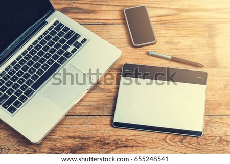 Workspace with notebook keyboard on wooden background. View from above, office table desk