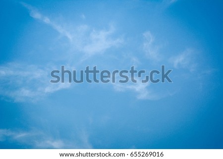 Blue sky in spring with a few white clouds