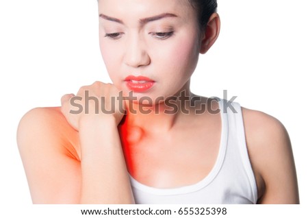 young women holding her shoulder in pain. isolated on white background. photo with red dot as a symbol for the hardening.