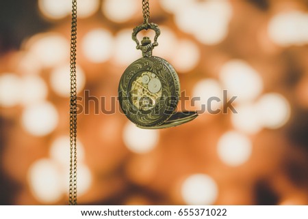 Old Clock Stock Photo. Gold Old Clock. Old Clock on Bokeh Backgrounds.