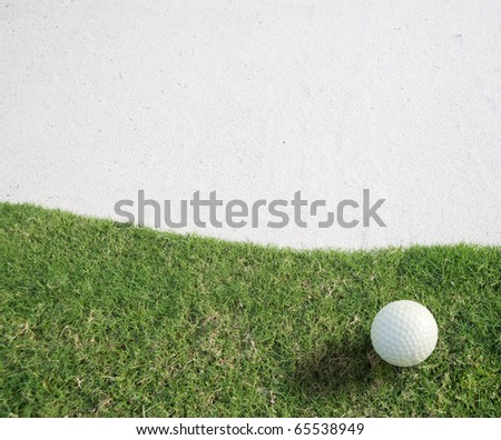 white Golf ball on green grass left side background ,,Golf sport is Balance of Yin Yang.Paste the text into the space 
right hand side