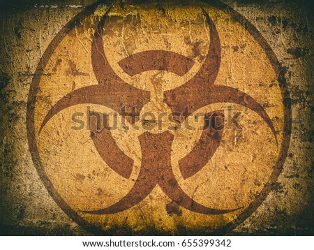 bio hazard symbol on a cracked stone wall. Grunge background