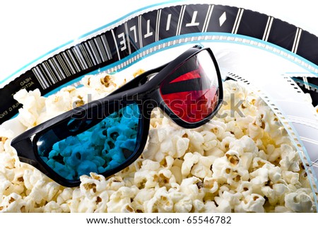 3-D glasses, film strip and popcorn, 3d experience Royalty-Free Stock Photo #65546782