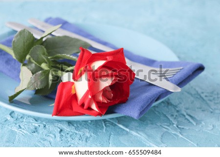 Festive table setting with rose  on  rustic table with copyspace