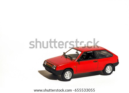 Toy car hatchback colored red isolated white background