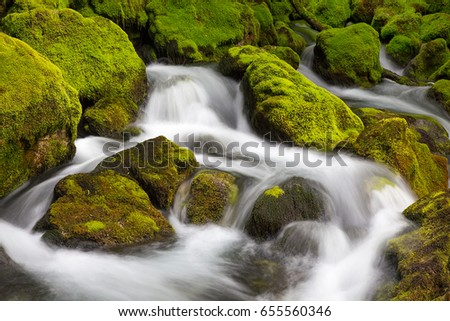Mountain river waterfalls with stones in moss - river Gljun, Bovec, Slovenia, water background, turquoise, river, stream, moss, stones, rocks, Soca valley, Triglav national park, Europe