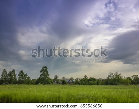 Beautiful rural landscape and cumulus cloudy blue sky high above