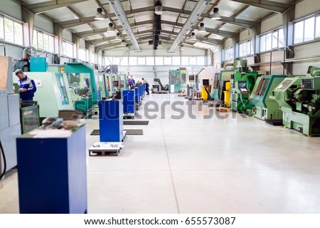 Industrial factory with cnc machines Royalty-Free Stock Photo #655573087