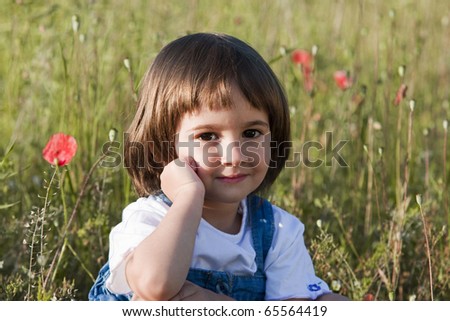 Little girl and poppies
