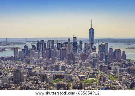 The One World Trade Center or Freedom Tower located in New York City. Architectural modern buildings at lower Manhattan. Skyline view at New York City - United States of America.