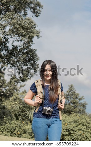 Women walking take photos in the forest