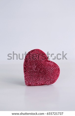 Red heart decoration closeup on white background