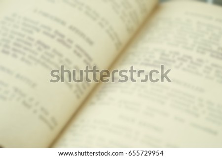 Opened old german book's pages blurred close-up background