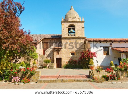 Carmel Mission or Mission San Carlos Borromeo de Carmelo bell-tower and gardens Royalty-Free Stock Photo #65573386