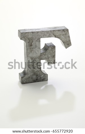iron letter F isolated on white