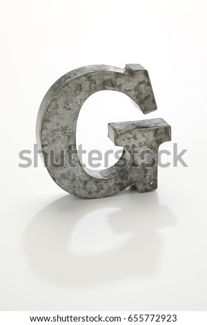 iron letter G isolated on white