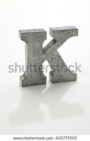iron letter K isolated on white