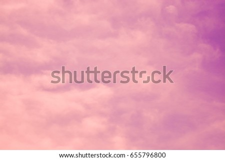 Soft cloud in pink and purple sky background. Pastel toned.