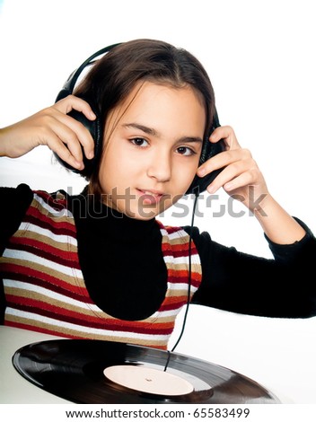 photo portrait of beautiful preschool child with headphones and plate isolated on white background