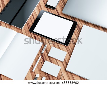 Computer, laptop, digital tablet, mobile phone, virtual headset and newspaper on wooden table. IT concept .