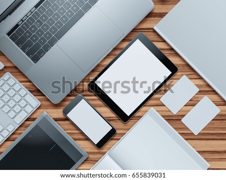 Computer, laptop, digital tablet, mobile phone, virtual headset and newspaper on wooden table. IT concept .
