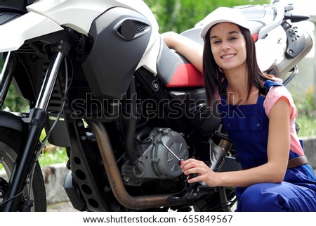 a student girl in motorbike mechanics