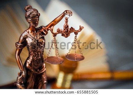Lady Justice. Book and Gavel in the background.