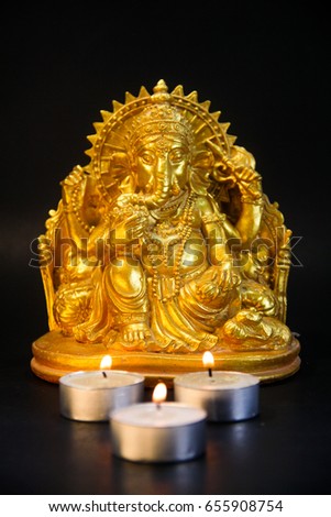 Ganesha lord of arts, Lord Ganesh sculpture,Hindu golden statue of ganpati.