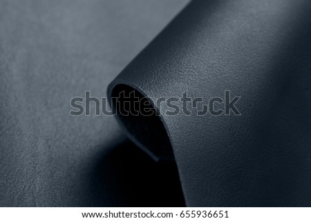 Stocks of a fabric are necessary for manufacture of a garment factory Close up of multicolored rolls of leather. High resolution photo