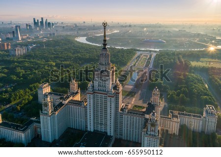 Moscow state university and Moscow city business center at sunrise. City in fog. Russia. Aerial View. Royalty-Free Stock Photo #655950112