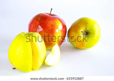 Two whole apple and half yellow with a slice on a white background