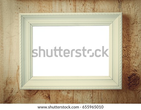 Picture frame with white space for texts or picture display put on wooden wall background