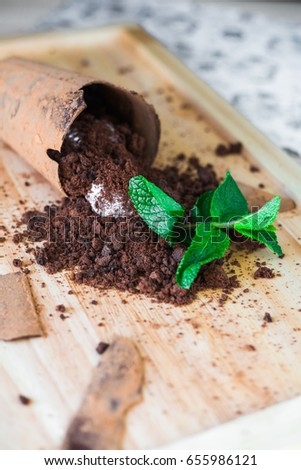 Close-up on a wooden board, trendy, tasty, chocolate dessert with ice cream, decorated with mint, beautiful stylish serve, restaurant