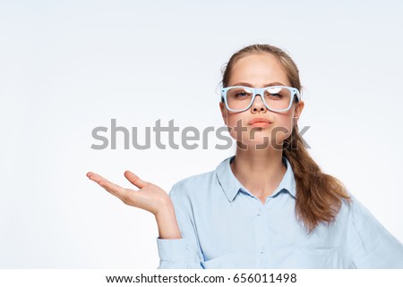 Woman in glasses on a light background                               