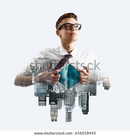 Business superhero double exposure concept. Young businessman showing super hero suit under his shirt