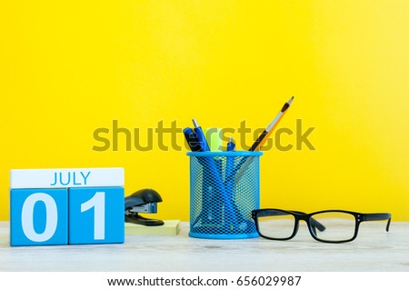 July 1st. Image of july 1, calendar on yellow background with office supplies. Summer time