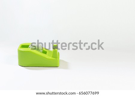 Green scotch tape holder isolated over white background and copy space