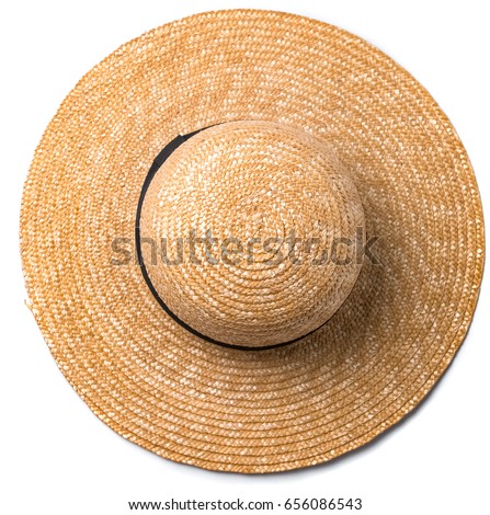 Pretty beautiful straw hat with ribbon and bow on white background beach hat from a side view isolated Royalty-Free Stock Photo #656086543
