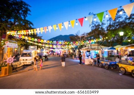 Blurred background : people shopping at market fair in sunny day, blur background with bokeh Royalty-Free Stock Photo #656103499