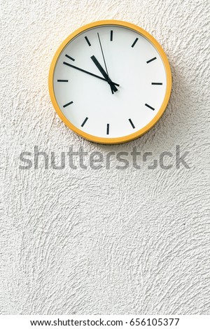 Simple analog clock on white wall loft concrete wall