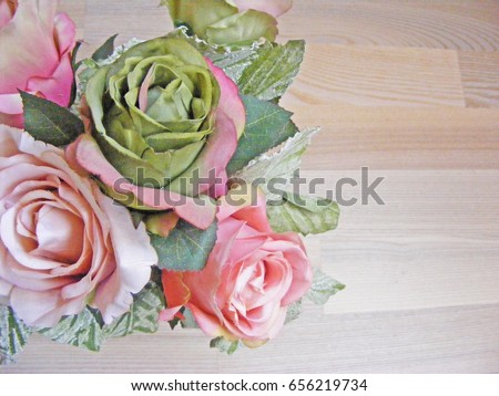vintage roses over wooden table