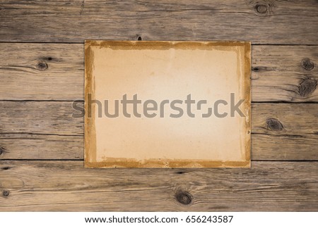 Old wooden boards, old paper with place for text. Vintage paper background. Passepartout