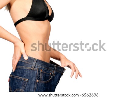Girl with a bikini and belly with big jeans showing weight loss.