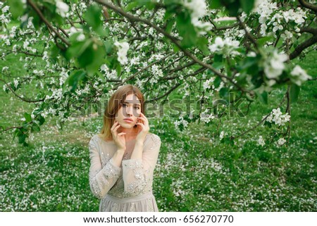 Portrait of girl on of flowers background.