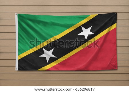 Saint Kitts and Nevis Flag hanging on a wall