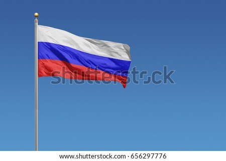 Russia flag in front of a clear blue sky