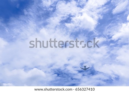 beautiful blue sky with amazing clouds with an airplane flying