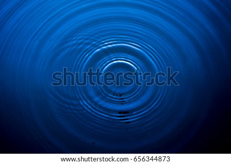 Top view Closeup blue water rings, Circle reflections in pool. Royalty-Free Stock Photo #656344873