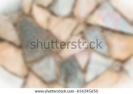 Blurred background. Friendly for designer Texture background image, granite stone is complex in the fence. Stone wall, background with plate. Abstract granite from wall texture