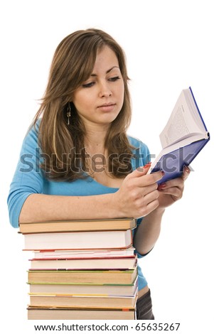 beautiful girl thoughtfully reading a book, surrounded by books